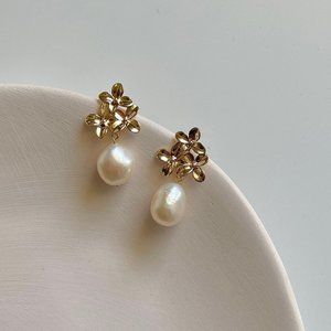 Gold floral earrings with dangling pearl